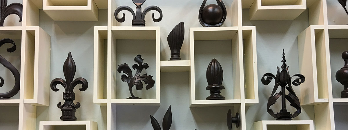 Slide compartmentalized iron finials